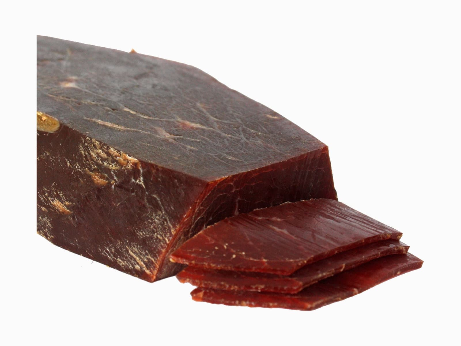 A block of beef cecina with a few freshly cut slices.