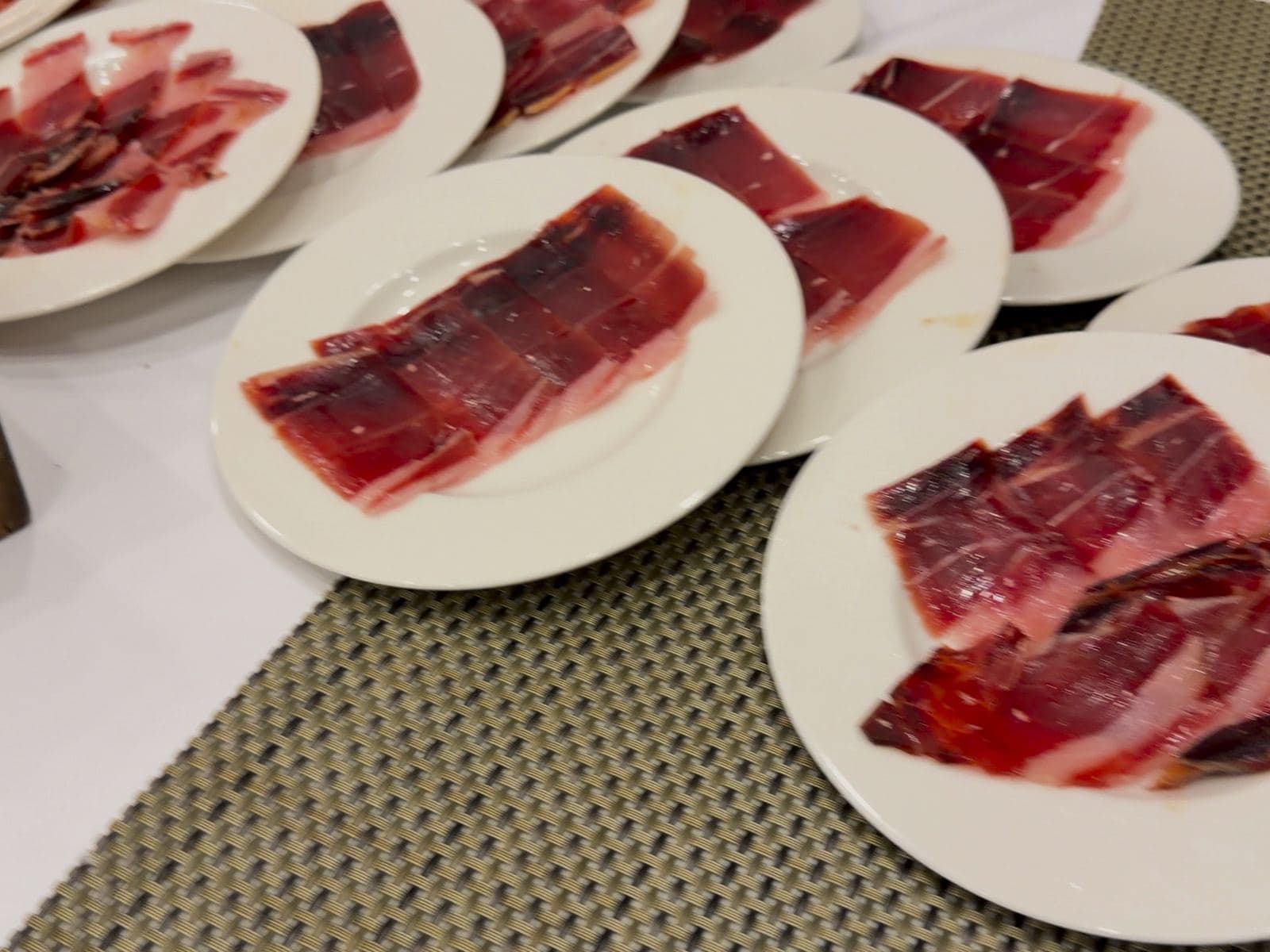 Plates of sliced Iberico ham, ready to serve.